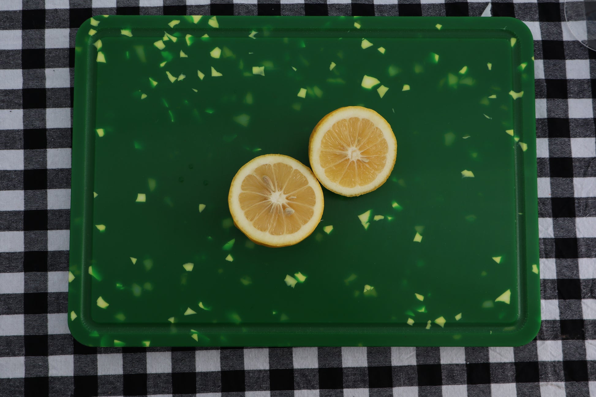 Green speckles chopping board with slice lemon on top