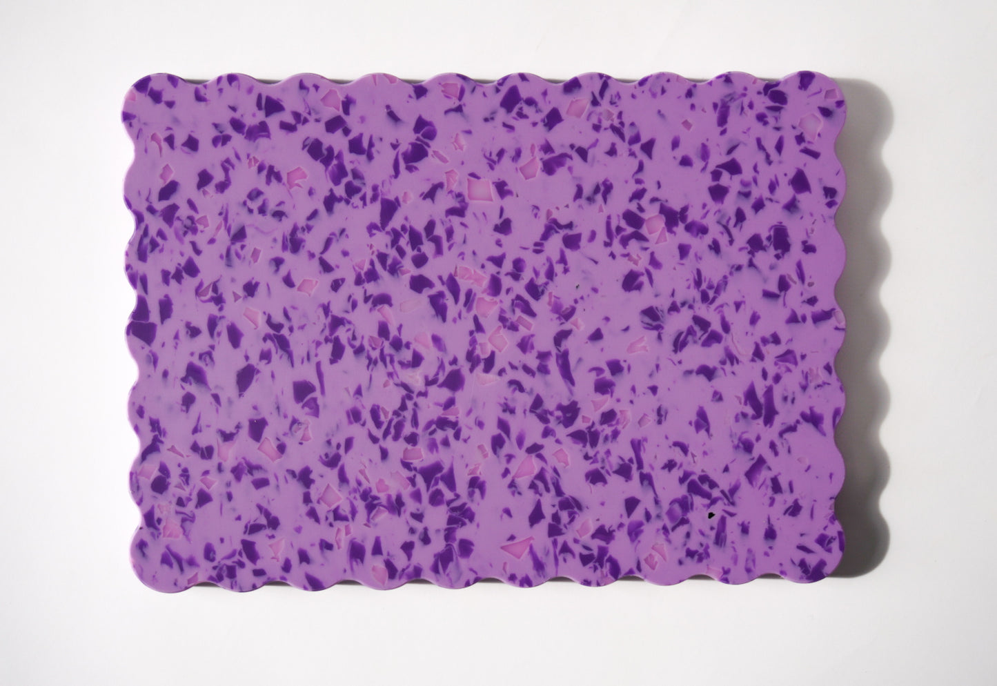 Purple speckled wavy chopping board