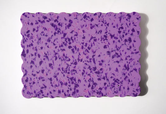 Purple speckled wavy chopping board