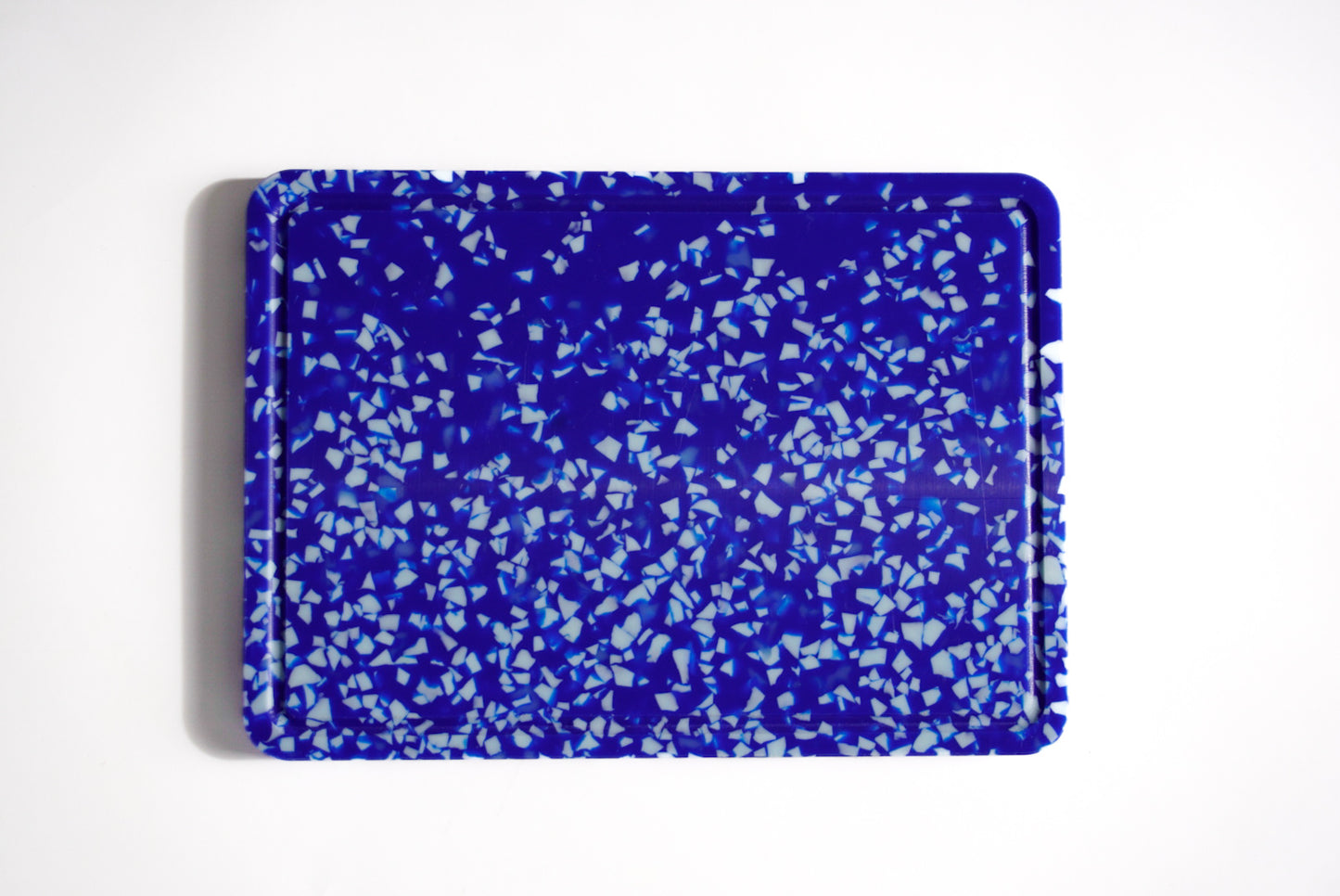 Blue and white speckled chopping board