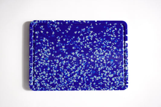 Blue and white speckled chopping board