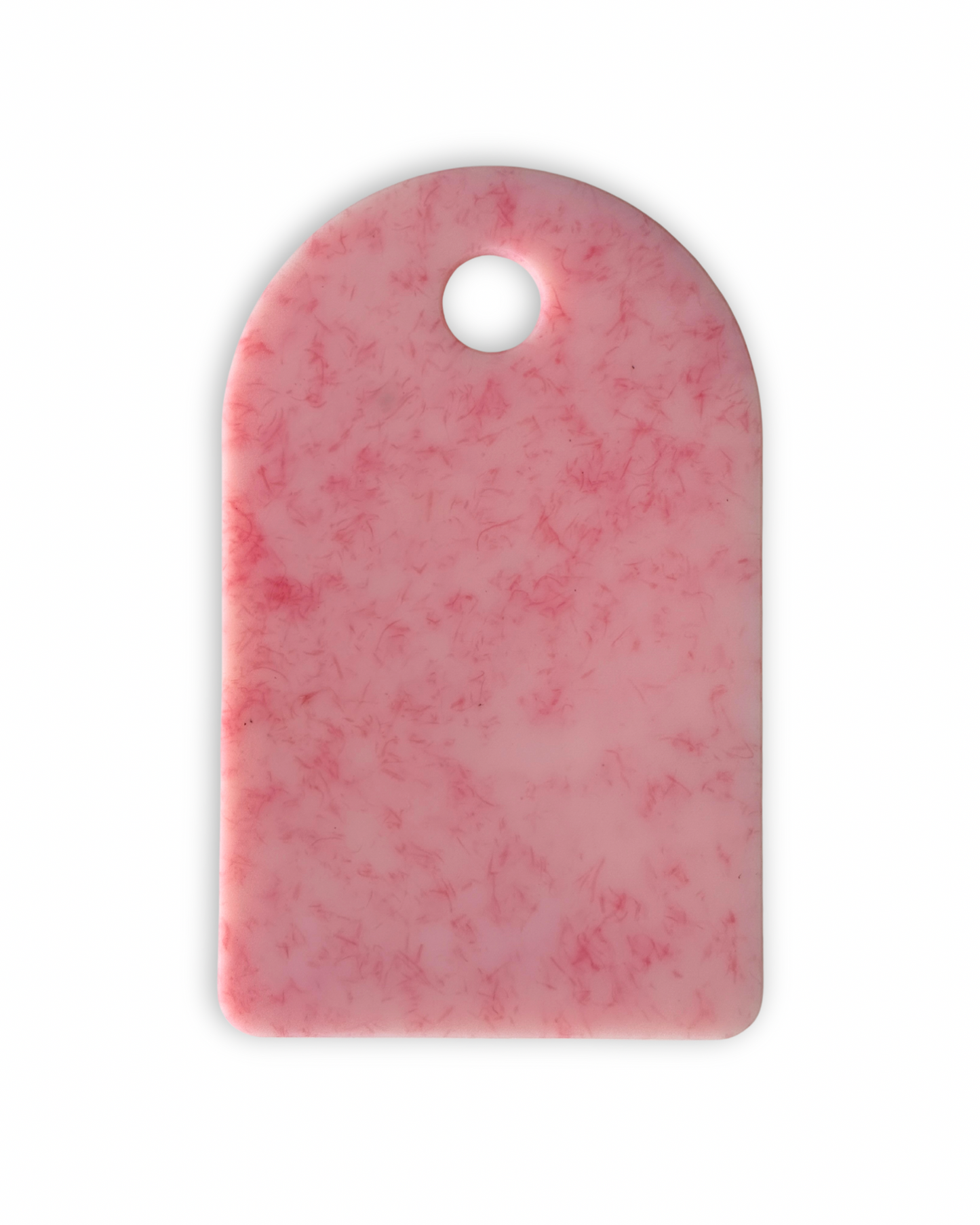 Pink chopping board with round end and hole for hanging