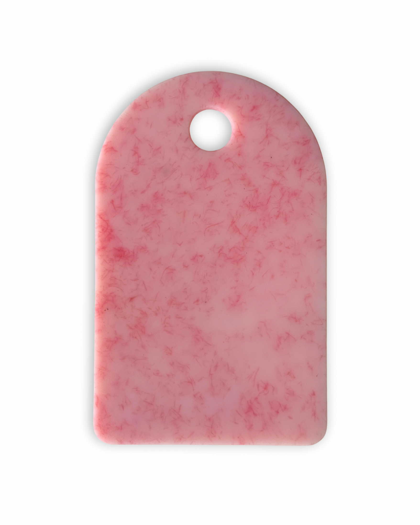 Pink chopping board with round end and hole for hanging