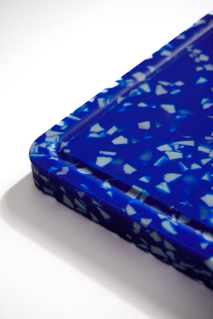 Blue and white speckled chopping board