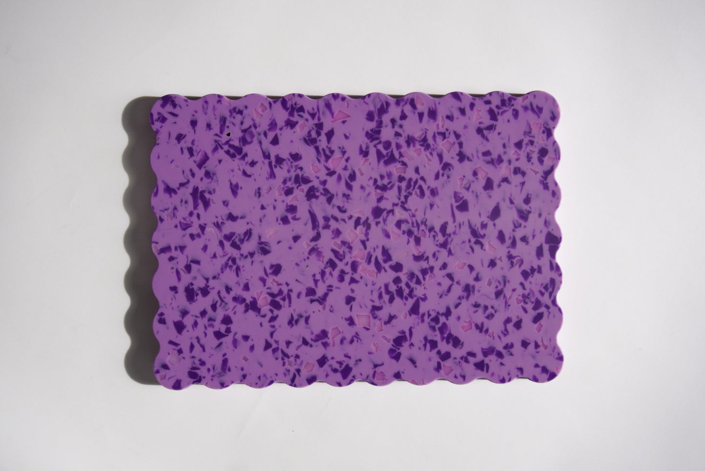 Purple speckled wavy chopping board