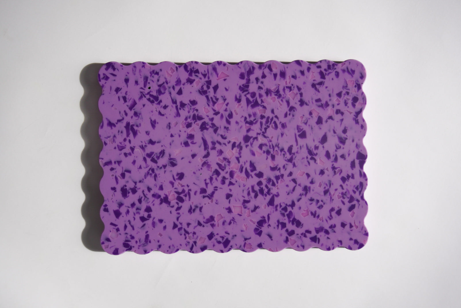 Purple speckled wavy chopping board