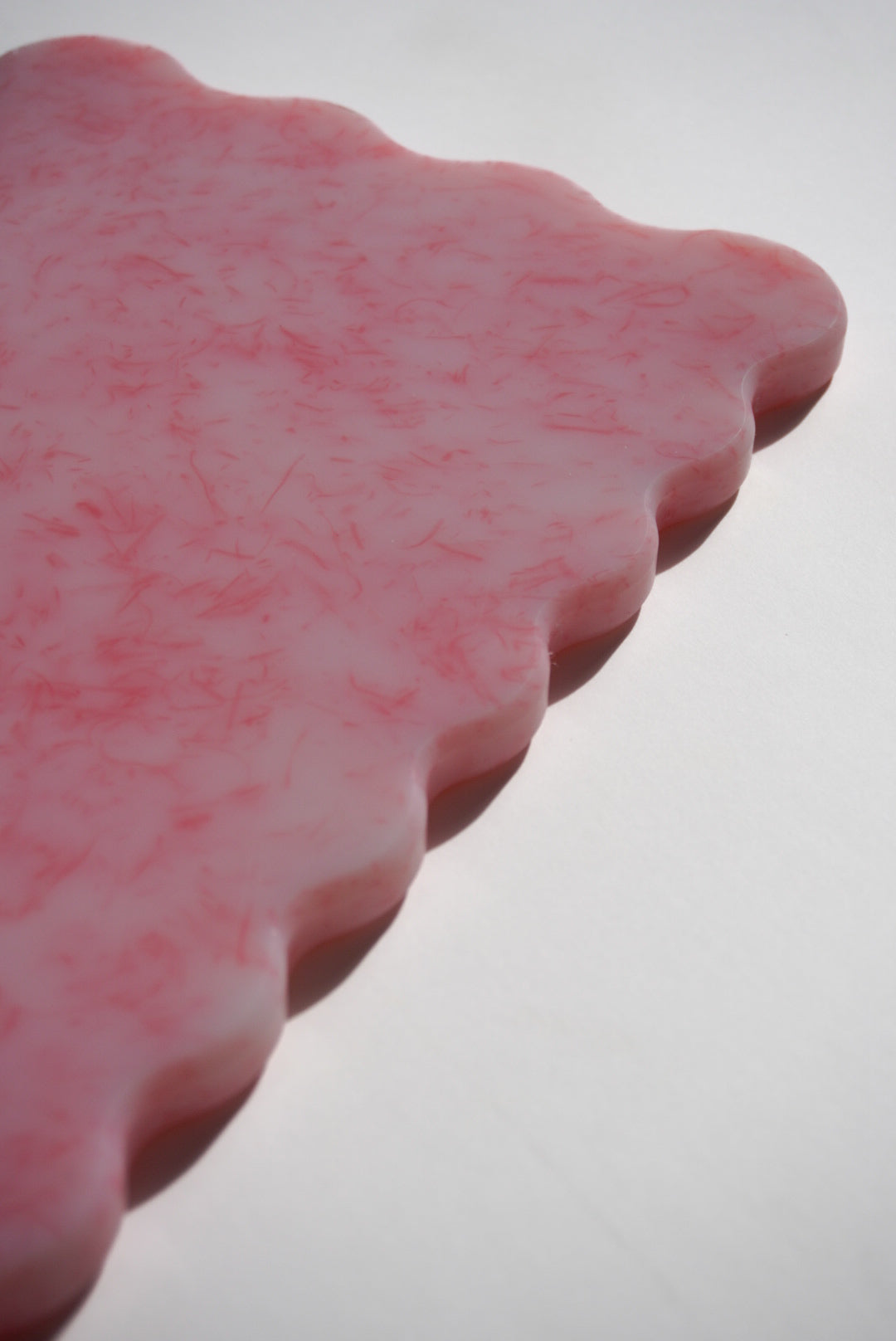 Close up pink wave chopping board