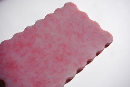 Close up pink wave chopping board