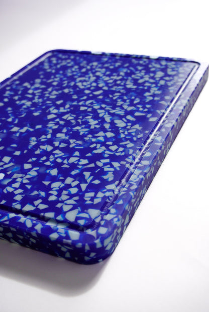 Blue and white speckled chopping board