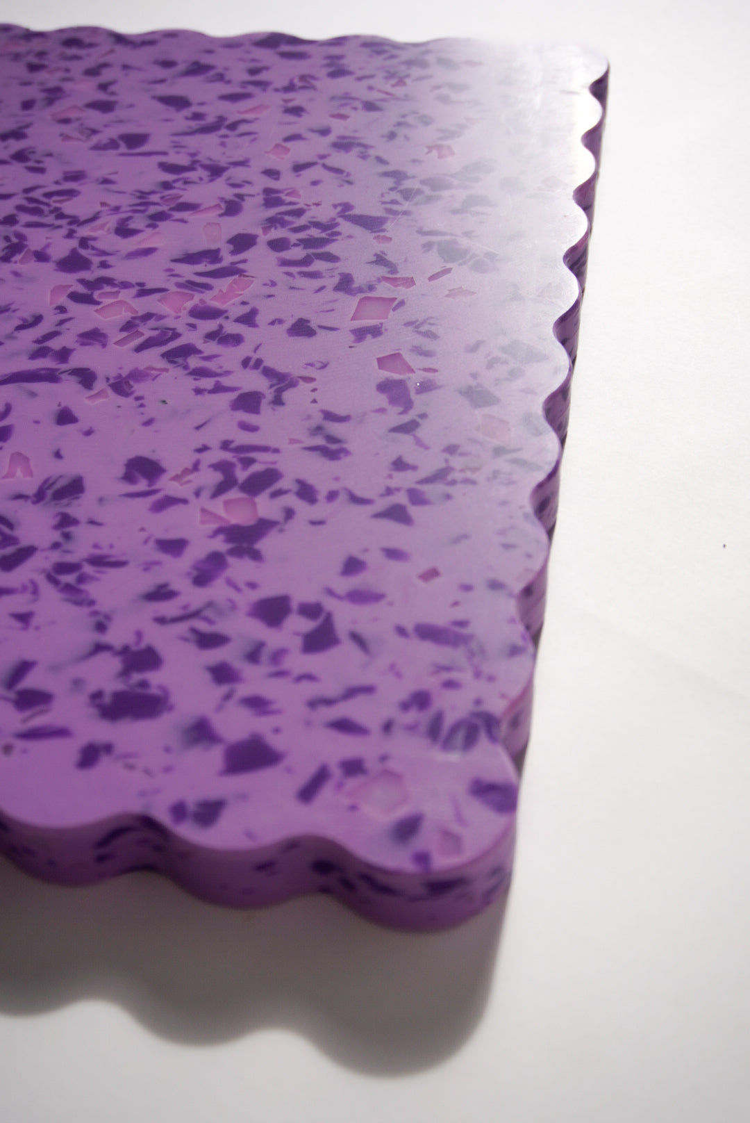 Purple speckled wavy chopping board